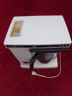 Mr. Coffee Sr. 8 cup model. Old and reliable. Needs a good cleaning.