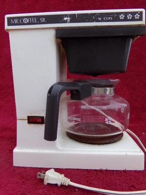 Mr. Coffee Sr. 8 cup model. Old and reliable. Needs a good cleaning.