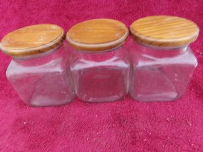 Three in a row! Square glass canisters. wooden lids with . . . .
