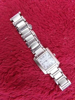 Classic Seville Quartz wristwatch w/metal folding snap band.