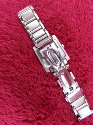 Classic Seville Quartz wristwatch w/metal folding snap band.