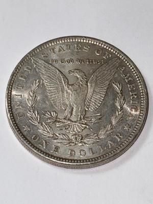1886 AU CONDITION MORGAN SILVER DOLLAR AS PICTURED.
