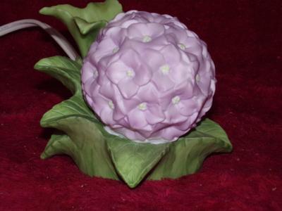 Ceramic night light w/internal bulb, cord switch. About 4-1/2" diameter.