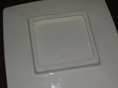 Footed square flat dish. Glazed ceramic, not labeled,