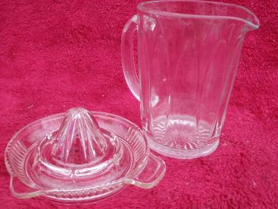 GOT JUICE? A small juice pitcher with citrus juicer. They go together