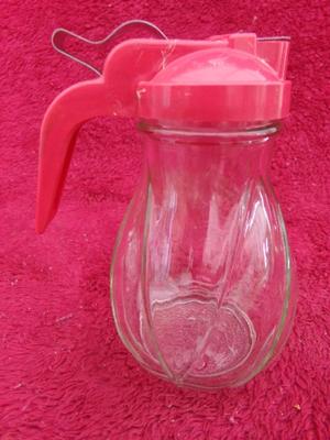 Group of 4 pancake/waffle syrup carafes of various sizes & styles.