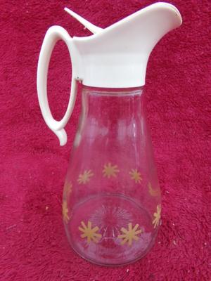 Group of 4 pancake/waffle syrup carafes of various sizes & styles.