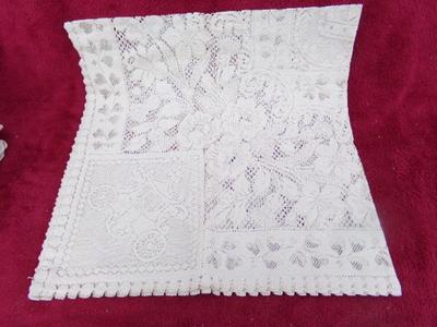 A collection of hand crafted items. Crocheted and embroidered items.