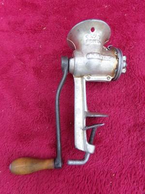 Small hand operated meat grinder. Old school but they always work.