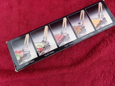 4 tongs in a box. Various uses.