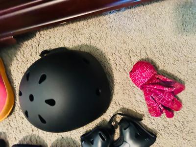 BOGS RAIN BOOTS AND CHILDREN'S HELMET KNEE PADS AND A SHOULDER PAD