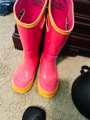 BOGS RAIN BOOTS AND CHILDREN'S HELMET KNEE PADS AND A SHOULDER PAD