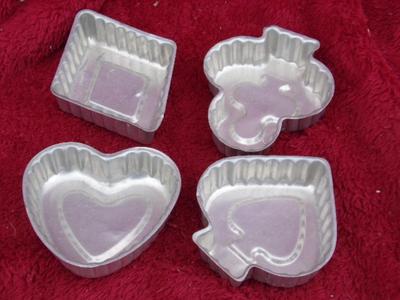 4 molds for four card suites. Mold Jell-O or bake single serving cakes