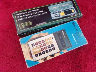 A driver set in case and a Rockwell calculator. Both in the OEM boxes.