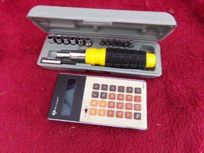 A driver set in case and a Rockwell calculator. Both in the OEM boxes.