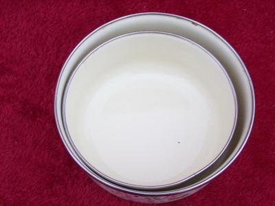 A couple of small porcelain steel nesting bowls w/chromed rims