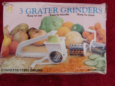 Cheese & vegetable grater, hand operated design. 3 different blade