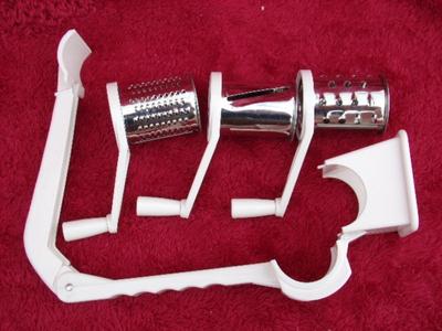 Cheese & vegetable grater, hand operated design. 3 different blade