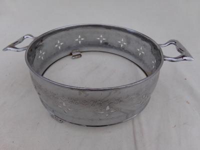 Large chrome bowl stand/trivet for table.