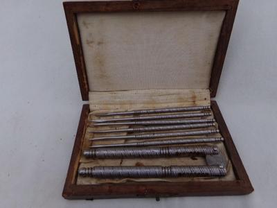 Classic VTG nut cracker w/6 pick set in a very nice wooden box.