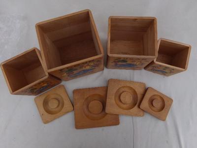 Nesting wooden canisters, set 4. Very nicely constructed of hardwood.