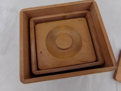 Nesting wooden canisters, set 4. Very nicely constructed of hardwood.