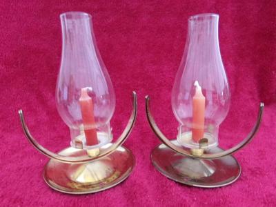 Pair of interesting candle lamps that pivot on their bases.