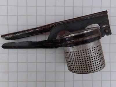 VTG/antique Hand operated juicer press. Holds about a cup full at a time.