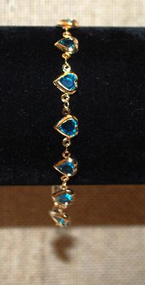 12 Blue Hearts Bracelet with Gold Tone Surrounds & Chain 7" Circumference