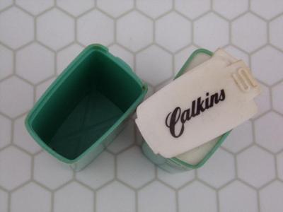 Pair of spice shakers/containers. Look like promotional items. HANDY!