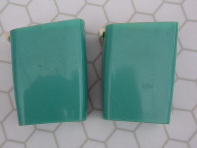 Pair of spice shakers/containers. Look like promotional items. HANDY!