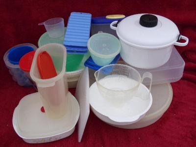 A pile of plastic kitchenware in a big box.