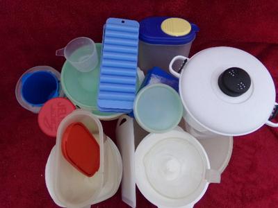 A pile of plastic kitchenware in a big box.