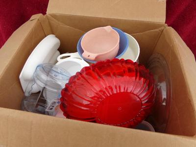 Pile #3 of plastic kitchenware in a big box.