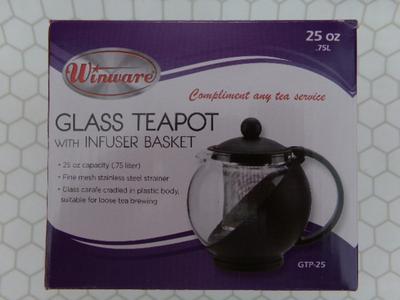 Glass Teapot w/infuser basket. Labeled 25 oz. Appears NEW IN BOX