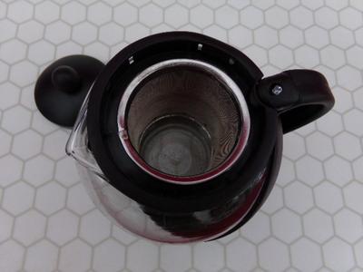 Glass Teapot w/infuser basket. Labeled 25 oz. Appears NEW IN BOX