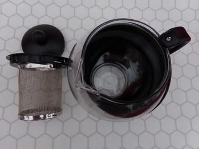 Glass Teapot w/infuser basket. Labeled 25 oz. Appears NEW IN BOX