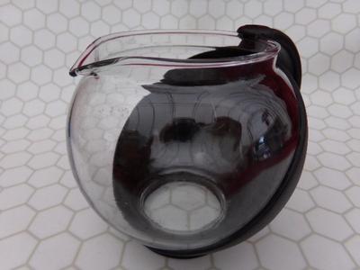 Glass Teapot w/infuser basket. Labeled 25 oz. Appears NEW IN BOX