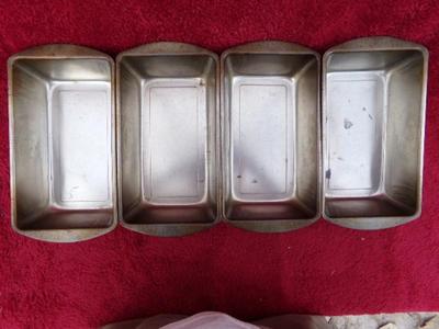 Group of 4 standard size metal bread pans. Generic.