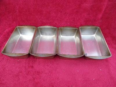 Group of 4 standard size metal bread pans. Generic.
