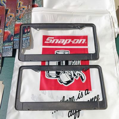 LOT 178: Snap-On License Plate Covers, Stickers, Plastic Bags, Cap & 1997 Snapshots Calendars