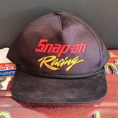 LOT 185: Snap-On License Plate Frames, Stickers, Plastic Bags, Snap-On Racing Cap & Snapshots 1997 Calendars