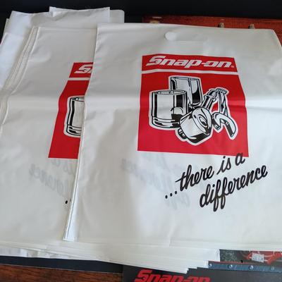 LOT 185: Snap-On License Plate Frames, Stickers, Plastic Bags, Snap-On Racing Cap & Snapshots 1997 Calendars