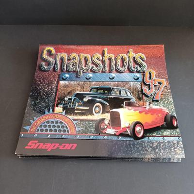LOT 185: Snap-On License Plate Frames, Stickers, Plastic Bags, Snap-On Racing Cap & Snapshots 1997 Calendars