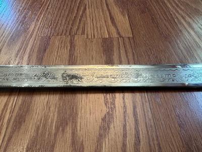SWORD WITH AN ENGRAVED BLADE