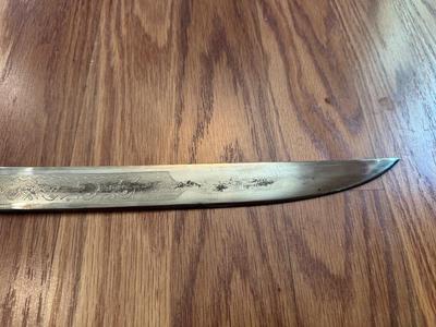 SWORD WITH AN ENGRAVED BLADE