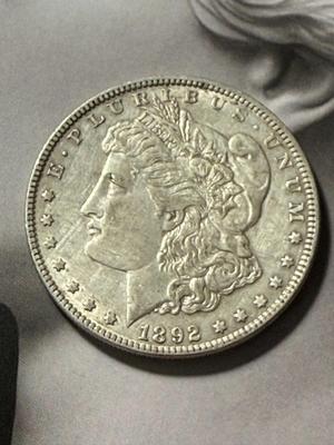 1892-P VERY FINE CONDITION LIGHTLY CLEANED MORGAN SILVER DOLLAR COIN AS PICTURED.
