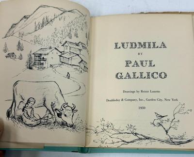 Sale Photo Thumbnail #442: Ludmila: A Legend of Liechtenstein is a 1954 children's book by Paul Gallico about a small cow named Ludmila who wants to win the Liechtenstein harvest ceremony's milk-production competition. The story is set in the Principality of Liechtenstein and featu