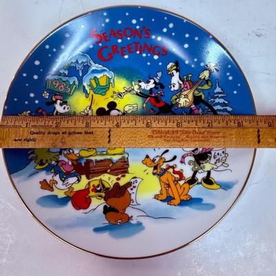 Sale Photo Thumbnail #242: Limited to 5,000 plates. Designed Exclusively for Disneyland and Walt Disney World. Made in Japan. Inspired by Walt Disney's Christmas Greeting for 1935. Measures 8 3/4" diameter. Trimmed in gold. With original box.