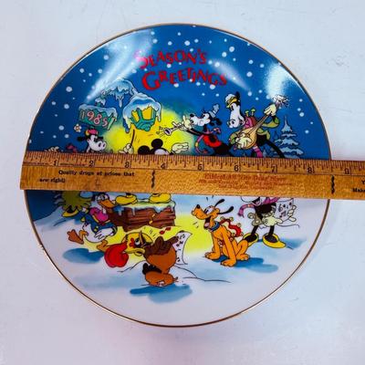 Sale Photo Thumbnail #241: Limited to 5,000 plates. Designed Exclusively for Disneyland and Walt Disney World. Made in Japan. Inspired by Walt Disney's Christmas Greeting for 1935. Measures 8 3/4" diameter. Trimmed in gold. With original box.